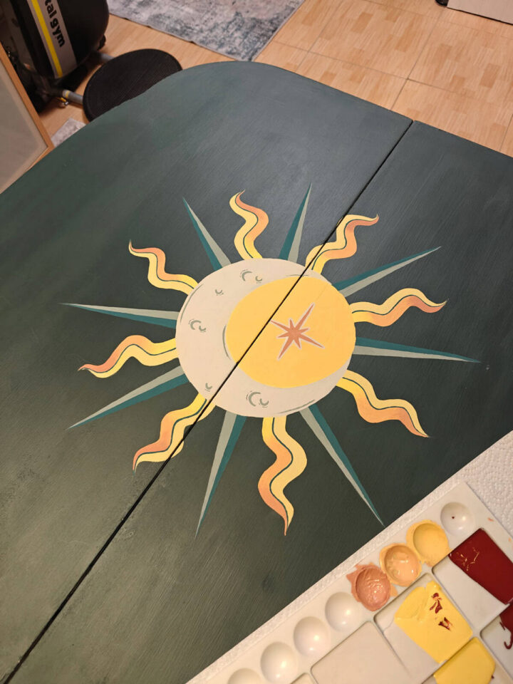 folding card table with a moon in the center. - pinterest image - by SabrinasOrganizing.com