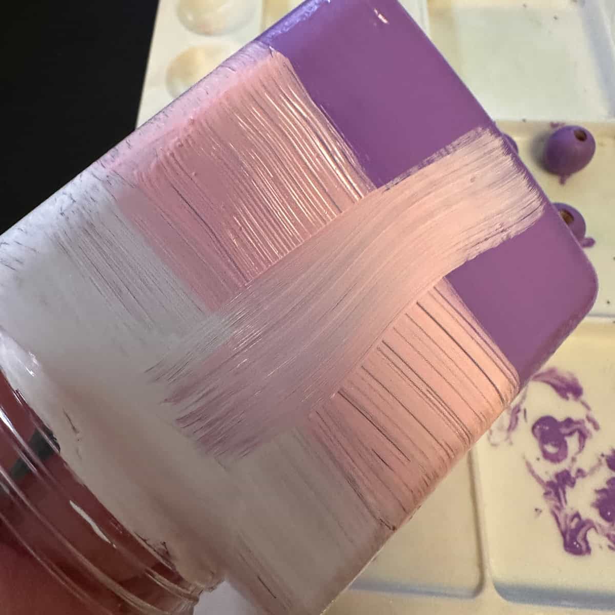 Use the paint brush (feather type) and brush down from white to darkest color -square image - it creates multicolor streaks