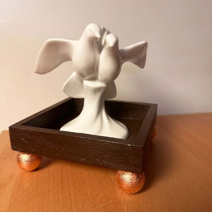 a dove statue on top of the finished tray - square image