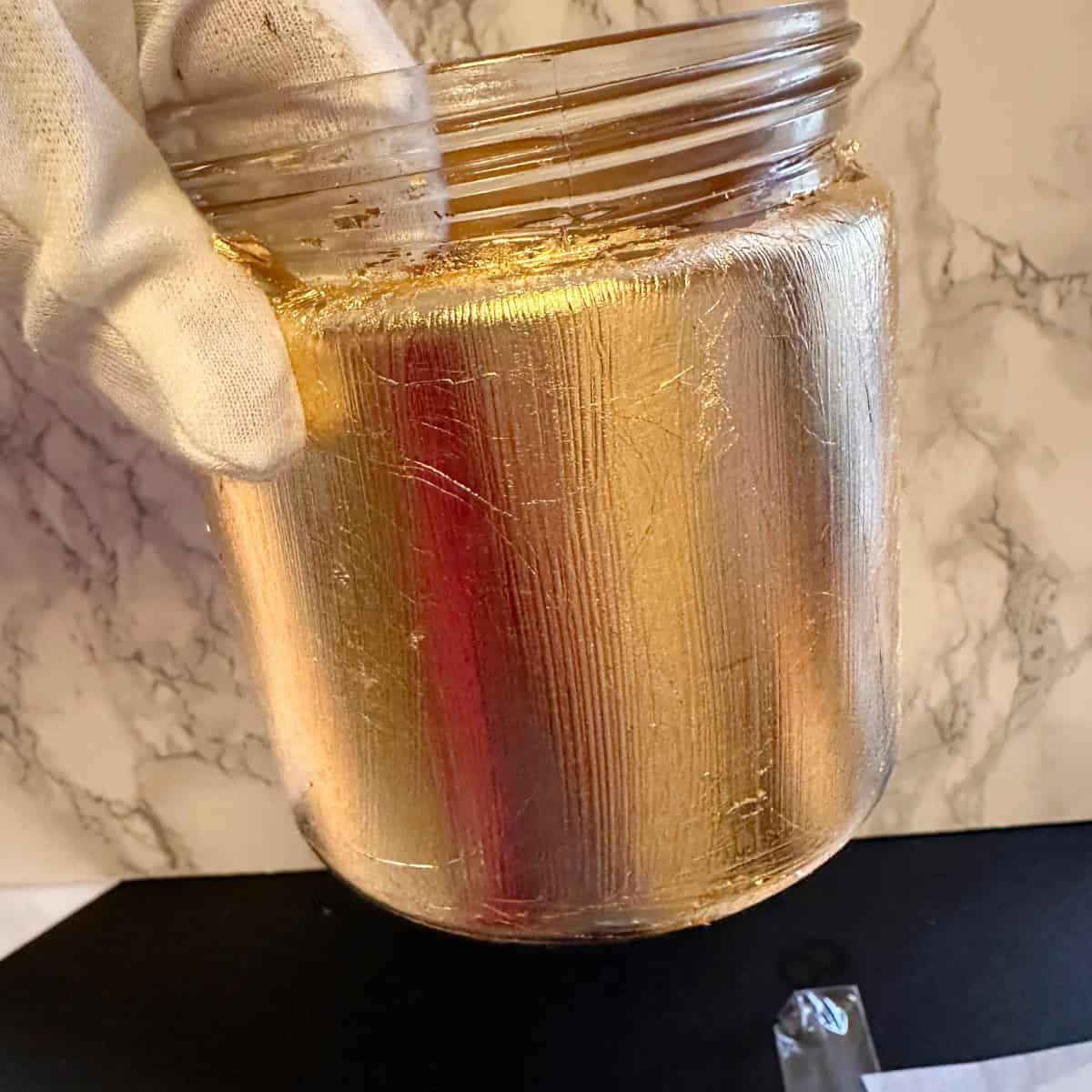 What it looks like on the vase after gold foil is smoothed